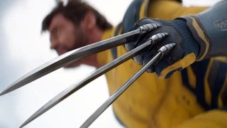 Hugh Jackman as Wolverine in Deadpool & Wolverine, wearing his iconic yellow outfit and with his adamantium claws extended.