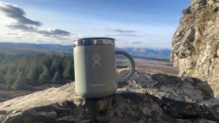 Hydroflask 12 oz coffee mug on a rock