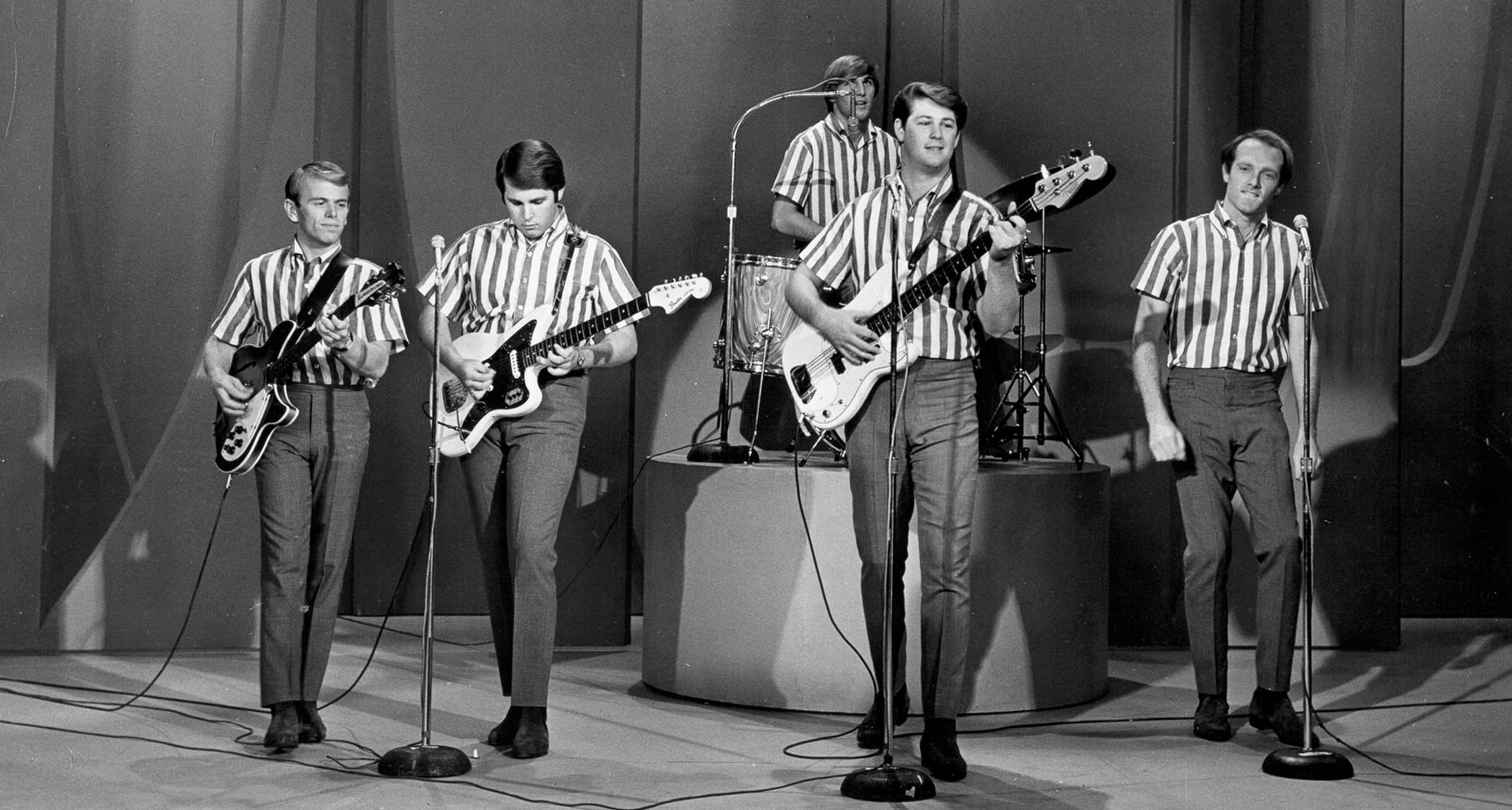 The Beach Boys perform Wendy on the Ed Sullivan Show, all wearing their candy striped shirts and dark slacks.