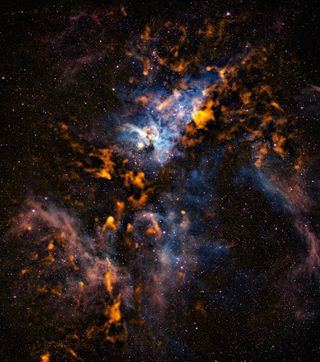 This image of the Carina nebula reveals the cold dusty clouds from which stars form in the bustling stellar nursery.