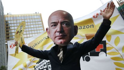 An activist dressed as Amazon CEO Jeff Bezos in Germany earlier this year