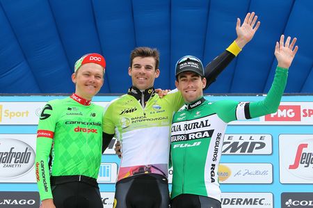 Lilian Calmejane atop the final Settimana Internazionale Coppi e Bartali podium flanked by runner-up Toms Skujins and third-placed Jaime Roson