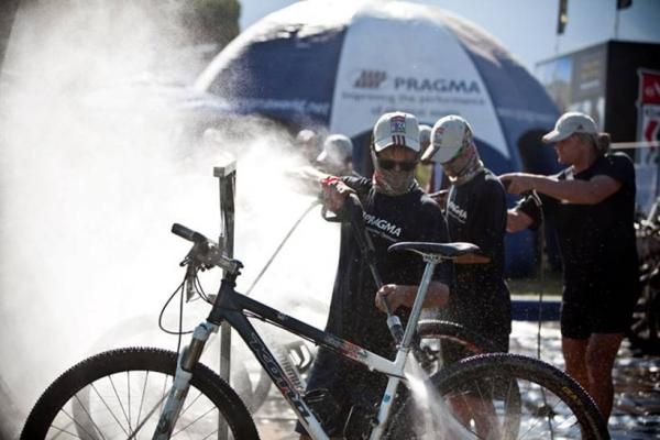 A rider's bike gets some TLC after a stage finish