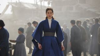 Moiraine Damodred (Rosamund Pike) in a blue robe in The Wheel of Time season 2.