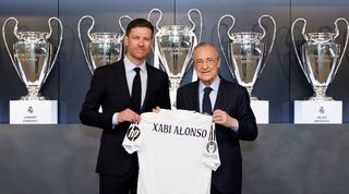New Real Madrid coach Xabi Alonso poses alongside president Florentino Perez after signing a contract with Los Blancos in May 2025.
