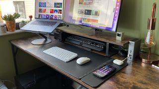 The Journey ALTI Wireless charging desk mat in a wood-lined office