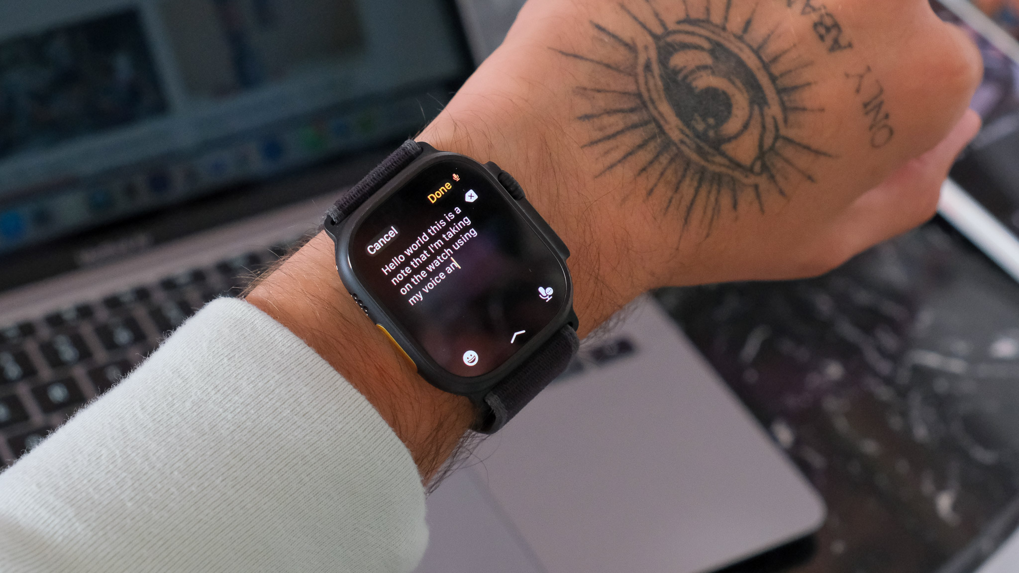 Black Apple Watch Ultra 2 displaying watchOS 26