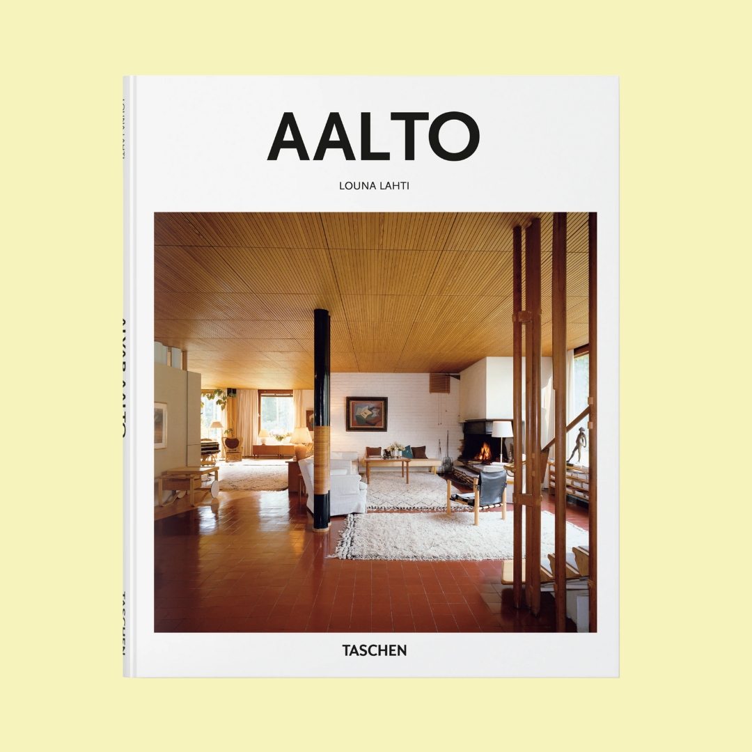 AALTO Book with Nordic, wood-clad warm interiors placed against a pale yellow background.