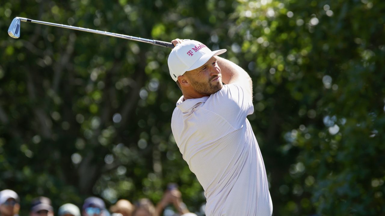 Wyndham Clark hits an iron
