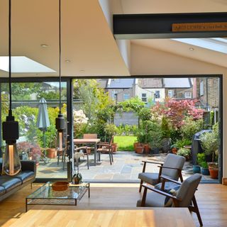 open plan kitchen backing on to garden through glass patio doors