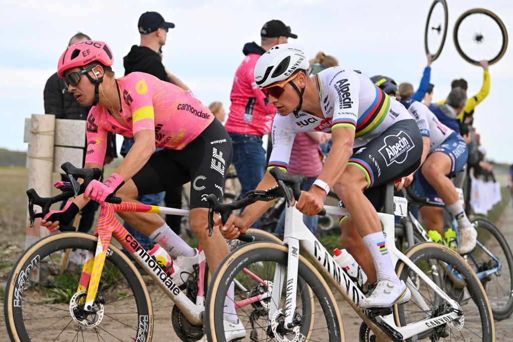 ROUBAIX FRANCE APRIL 07 LR Stefan Bissegger of Switzerland and Team EF Education EasyPost and Mathieu van der Poel of The Netherlands and Team Alpecin Deceuninck compete passing through the Haveluy Wallers cobblestones sector during the 121st ParisRoubaix 2024 a 2597km one day race from Compiegne to Roubaix UCIWT on April 07 2024 in Roubaix France Photo by Luc ClaessenGetty Images