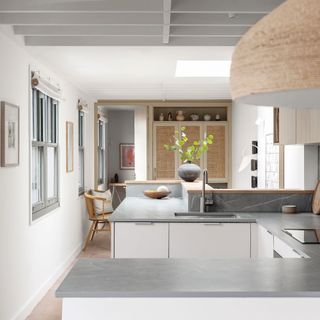 kitchen with grey countertops, breakfast bar and dining area
