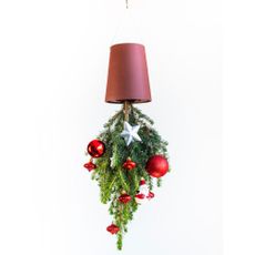 upside down plant pot with christmas decorated plant hanging on wall