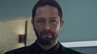 A screenshot of Ebon Moss-Bachrach as Richie looking very serious in a close up during Season 3 of The Bear.