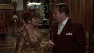 Mrs. Peacock talking to Col. Mustard in Clue