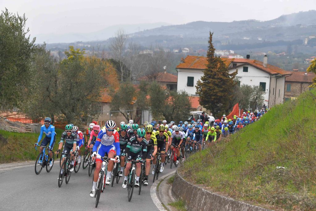 The peloton takes on the rolling terrain