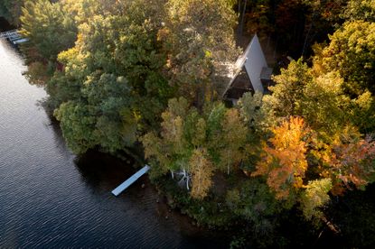 Aerial hero view of Lake Placid A-Frame house by Strand Design 