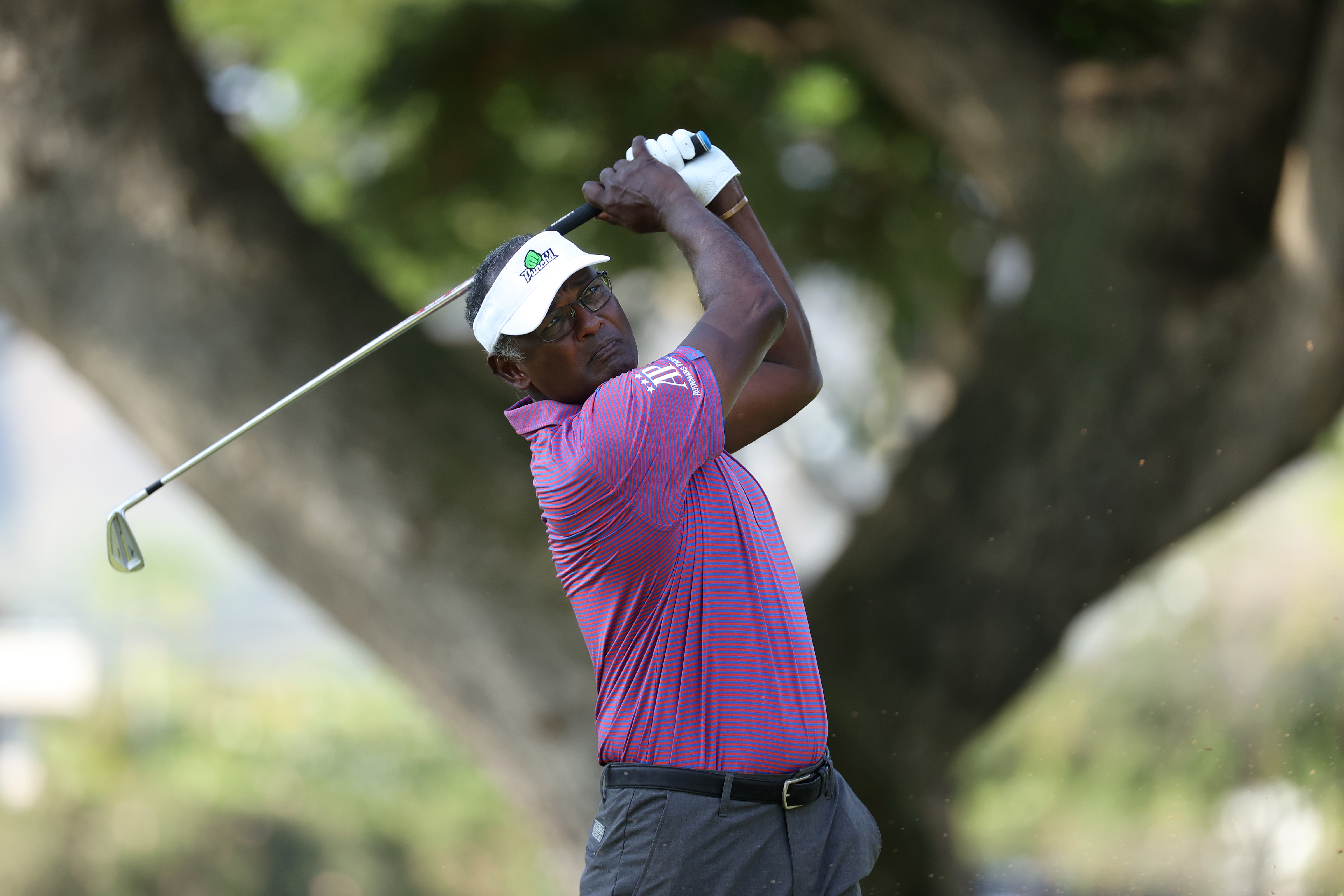 Vijay Singh hits an approach shot into the green