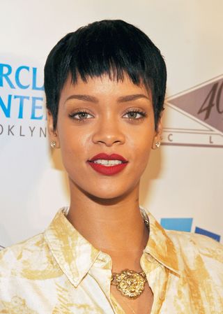 rihanna with short hair styled in a pixie cut.