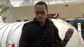 Dwayne Johnson gestures in mid speech in Reno 911!: Miami.