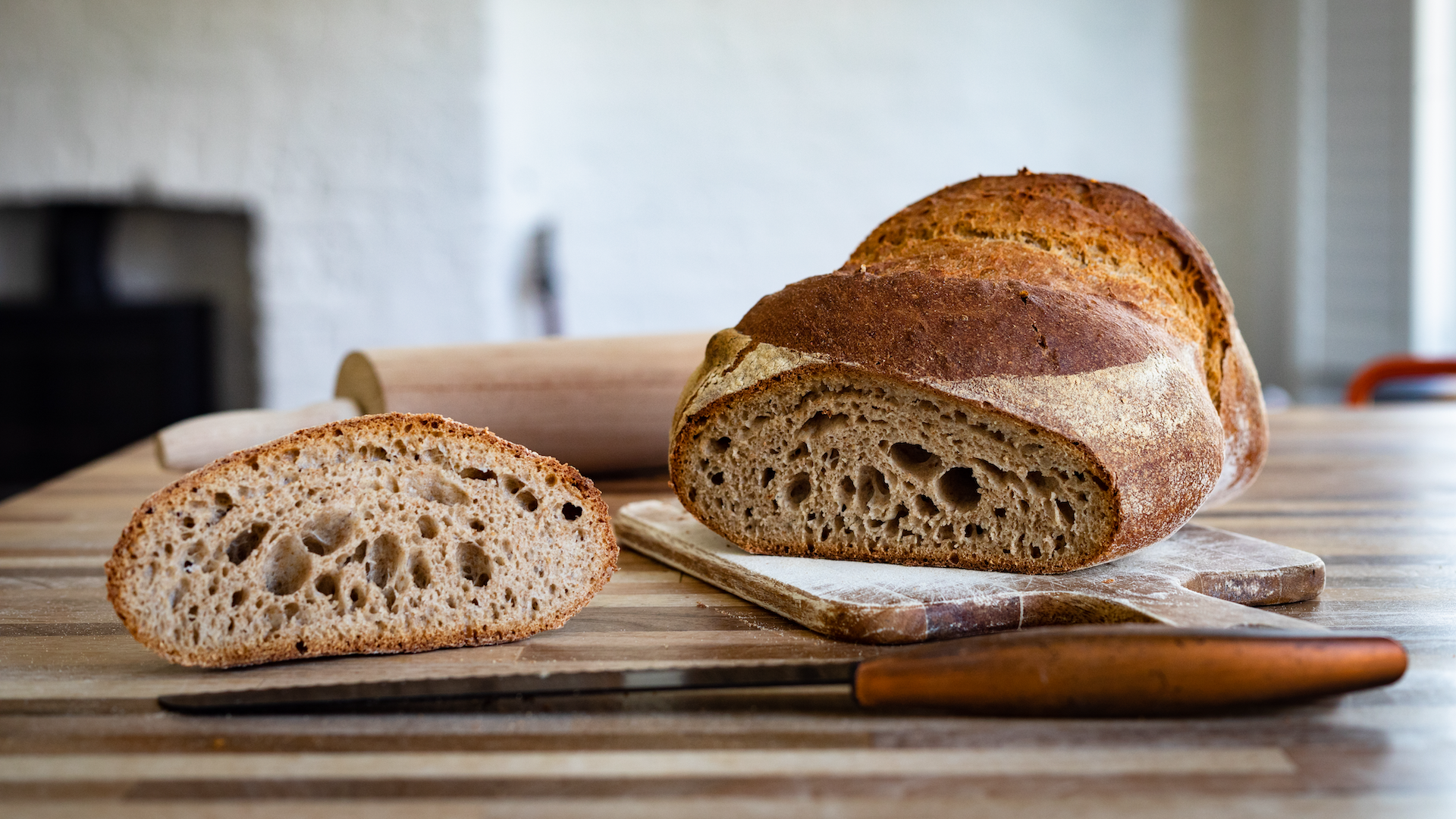 Loaf of sourdough bread being sliced