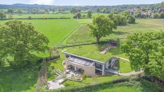 Birdseye view of the eco home showing the grass roof