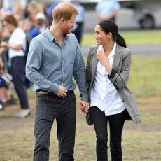 dubbo, australia october 17 prince harry, duke of sussex and meghan, duchess of sussex meet local community members as they attend the naming dedication and unveiling of a new aircraft in the royal flying doctor service rfds fleet at dubbo airport on october 17, 2018 in dubbo, australia the duke and duchess of sussex are on their official 16 day autumn tour visiting cities in australia, fiji, tonga and new zealand photo by karwai tangwireimage