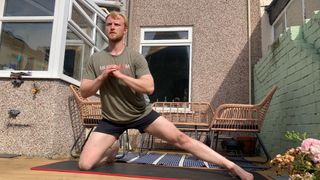 Fit&Well writer Harry Bullmore doing a single-leg frog stretch
