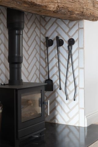 Furnace in white tiled fireplace