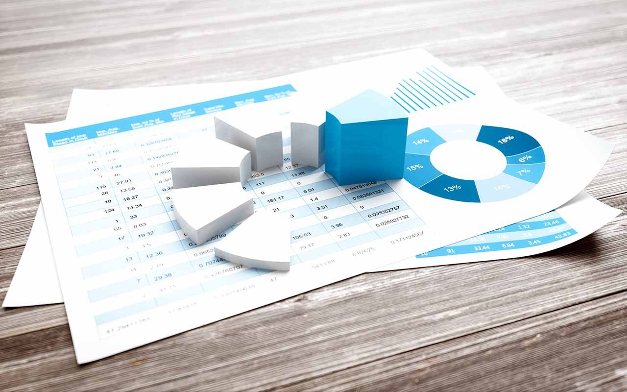 3d pie chart on finance report and old wood table