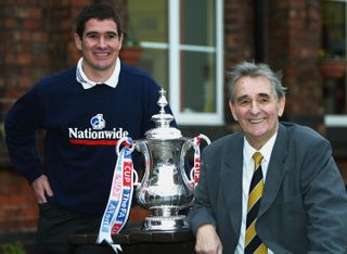 Burton Albion player manager Nigel Clough and his father Brian Clough pose with the FA Cup trophy in 2003.