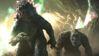 Godzilla and Kong roaring and running towards a fight in Hollow Earth in Godzilla x Kong: The New Empire.