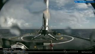 The first stage of a SpaceX Falcon 9 rocket stands on the deck of the droneship "Of Course I Still Love You" after launching the Es'hail-2 satellite on Nov. 15, 2018.