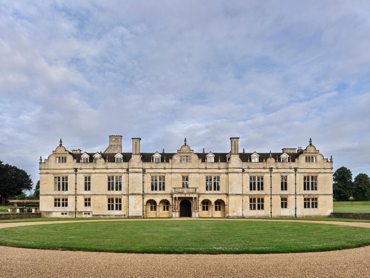 Fig 1: The east front of the 1620s with its central loggia. The gallery extends across the first floor and there is a parapet walkway for watching the hunt on the roof. Apethorpe Palace, Northamptonshire. Credit: Paul Highnam for Country Life