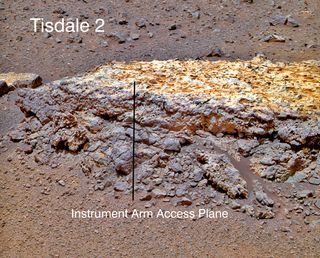 This rock, informally named "Tisdale 2," was the first rock NASA's Mars rover Opportunity examined in detail on the rim of Endeavour Crater. It has textures and composition unlike any rock the rover examined during its first 90 months on Mars. Its characteristics are consistent with the rock being a breccia — a type of rock fusing together broken fragments of older rocks.