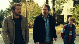 Ryan Reynolds, Mark Ruffalo, and Walker Scobell walking together in The Adam Project.