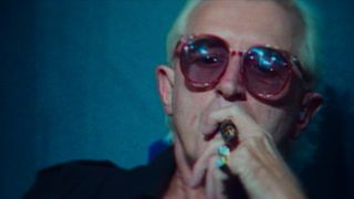 Footage of Jimmy Savile smoking a cigar from Jimmy Savile: a British Horror Story.