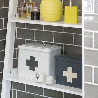 grey and white brick designed wall white shelf and grey and white container