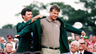 Larry Mize hands Sandy Lyle the Green Jacket in 1988