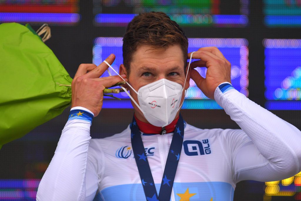 PLOUAY FRANCE AUGUST 24 Podium Stefan Kung of Switzerland Gold Medal European Champion Jersey Celebration Mask Covid Safety Measures during the 26th UEC Road European Championships 2020 Mens Elite Individual Time Trial a 256km race from Plouay to Plouay ITT UECcycling EuroRoad20 on August 24 2020 in Plouay France Photo by Luc ClaessenGetty Images