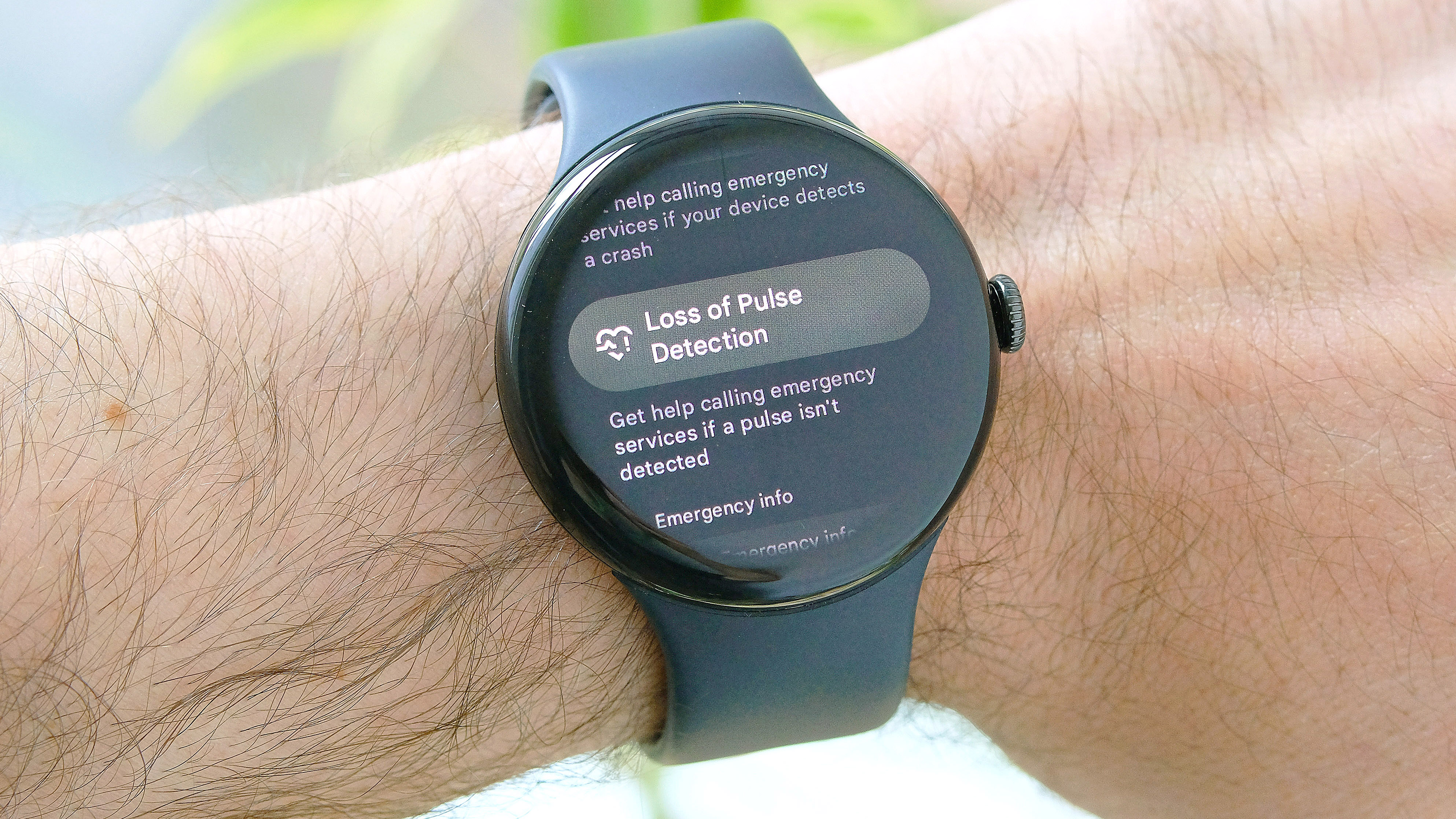 Pixel Watch 3 shown on a user's wrist with the Loss of Pulse feature displayed on the screen