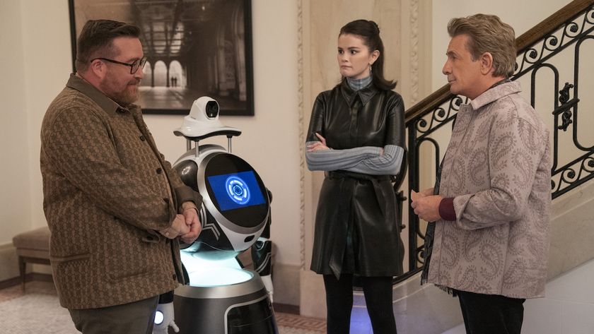 Howard, Oliver and Mabel talking as L.E.S.T.R robot sits nearby in Only Murders in the Building