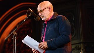LONDON, ENGLAND - APRIL 18: Brian Eno speaks during SUMUD, a fundraising event for Palestine, organised by the Amos Trust, at Union Chapel on April 18, 2024 in London, England. Sumud, meaning 'steadfast perseverance' in Arabic, is a common term used to describe Palestinian non-violent, resistance against Israel's occupation. Amos Trust is a small, creative human rights organisation who have been working in Palestine for over 30 years with local and international peace activists, partnering with grass-roots projects, campaigning for Palestinian rights. (Photo by Jim Dyson/Getty Images)