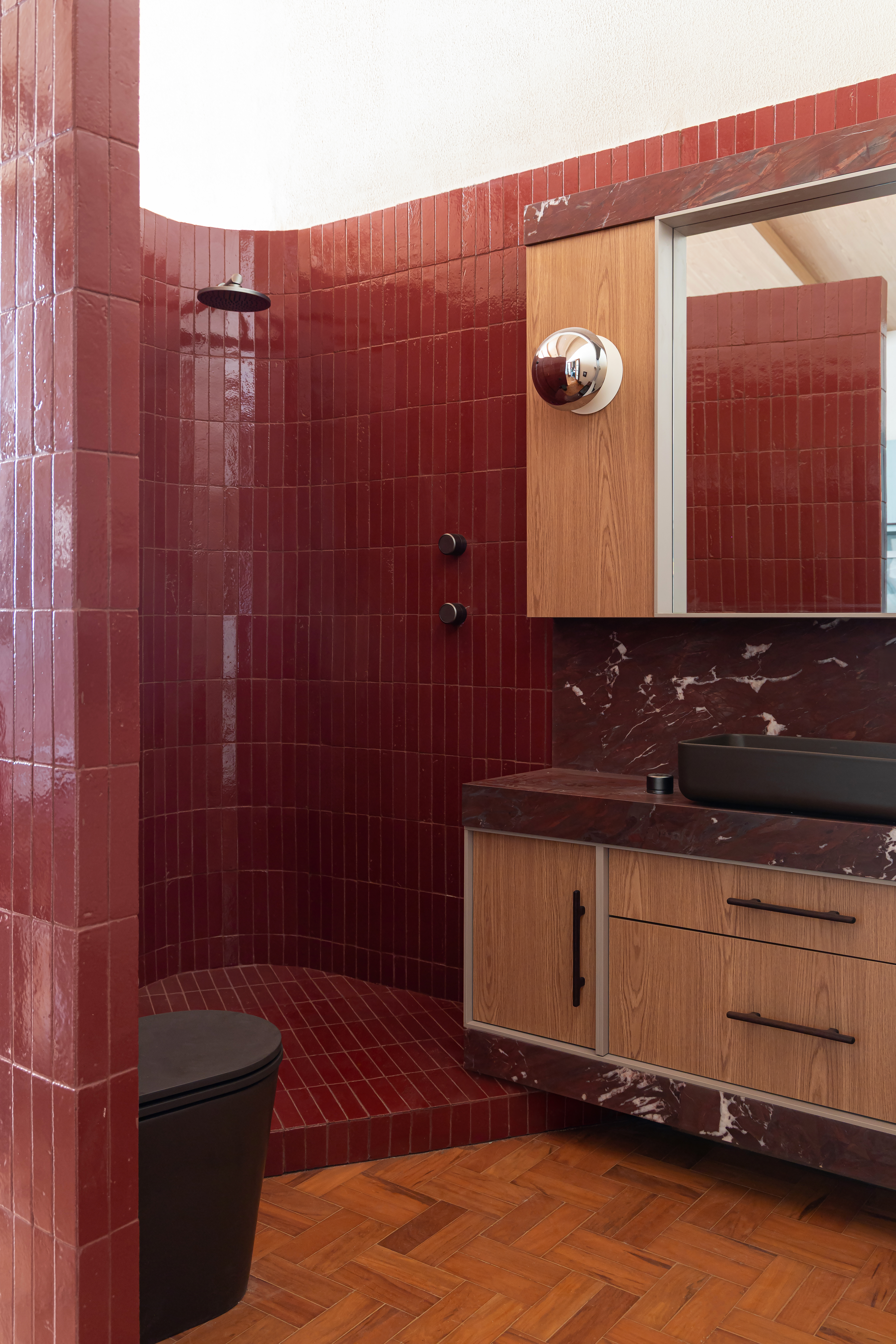Bathroom with rich burgundy tiles