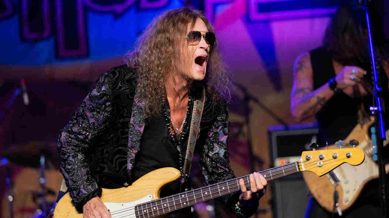 Glenn Hughes performing onstage in 2024