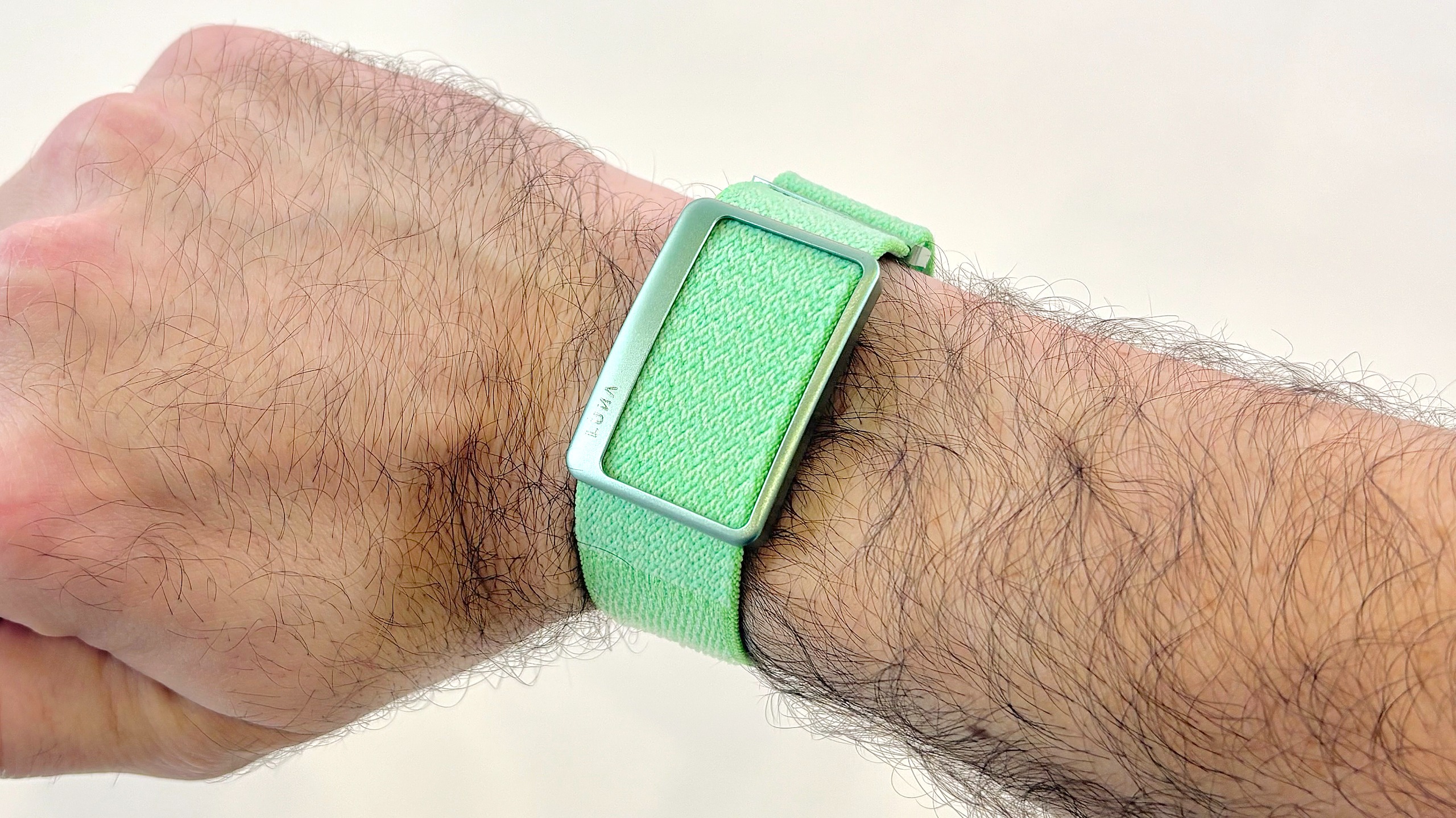 Close-up of the Garmin Cirqa screen-free tracker next to the Luna Band at IFA 2026 in Berlin