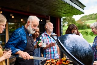 Family barbecuing food