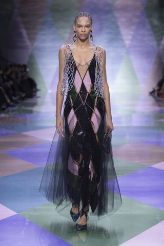 Woman on Armani runway in harlequin tulle gown