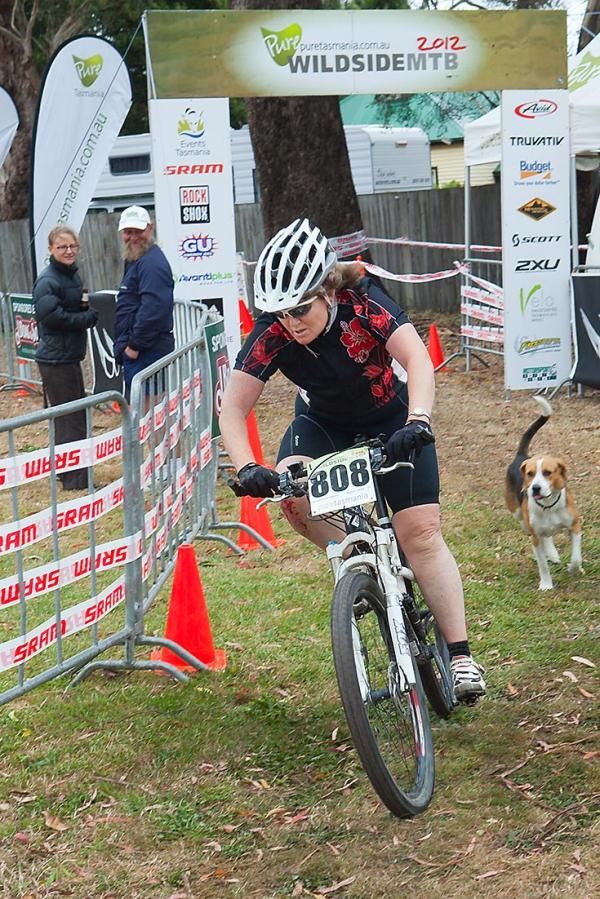 After days of extreme heat, heavy rain and a cold blast, Victorian Carolyn Jackson is finally chased over the line in Strahan by a local dog.