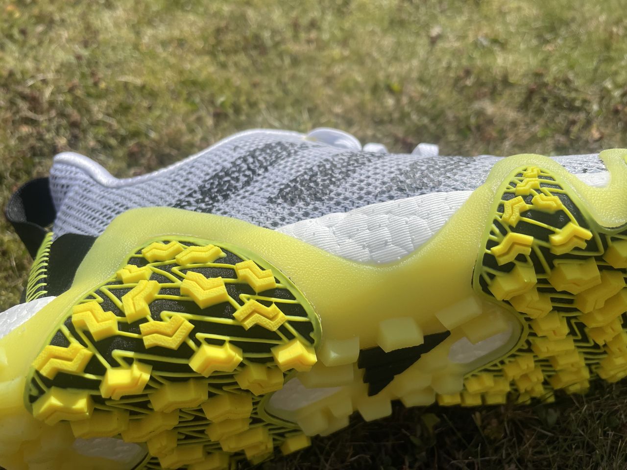 A detailed look at the wraparound outsole on the adidas codechaos 22 golf shoe
